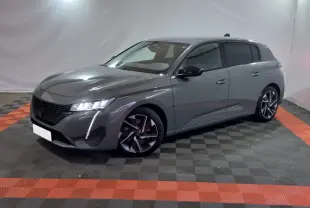 Peugeot 308 PHEV gris foncé vue 3/4 avant droit, avec feux LED et jantes alliage distinctives.