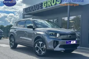 Citroën C3 Aircross gris Mercury vue 3/4 avant droit, avec jantes alu et barres de toit visibles.