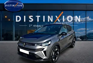 Renault Captur 1.8 e-tech gris cassiopée en 3/4 avant droit avec jantes noires et calandre distinctive.