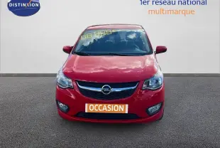 Vue frontale d'une Opel Karl rouge 2015 avec calandre chromée et plaque "OCCASION" visible.