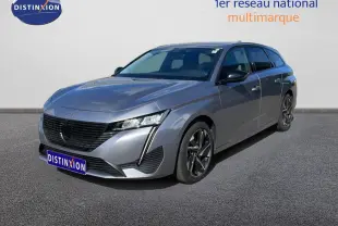 Peugeot 308 SW gris Artense métal vue 3/4 avant droit, mettant en valeur ses optiques LED et jantes alliage.